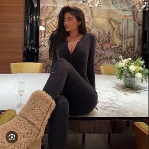 NO LONGER AVAILABLE SKIMS RHINESTONE LOGO POINTELLE ONESIE IN ONYX